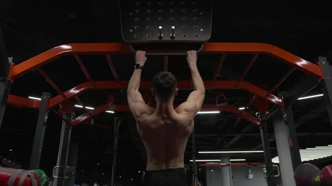 Man sportsman do pullup exercise. Muscular biceps and triceps. Strong athlete Stock Footage 346723896