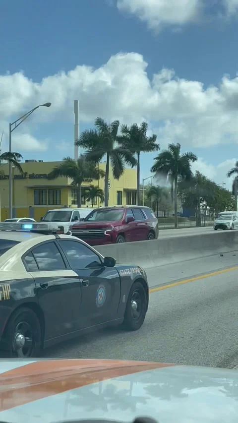 Man Spotted Sitting on Tractor Trailer, Miami, Florida, USA - 09 Mar 2022 Stock Footage 205426819