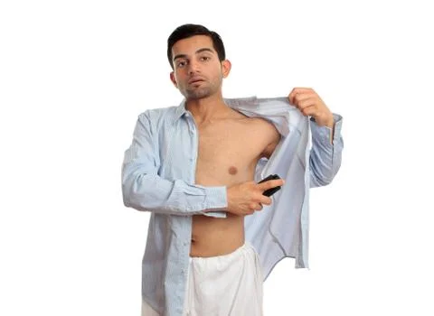 Man spraying deodorant Stock Photos