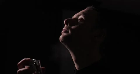 Man spraying perfume on his neck, slow motion 스톡 동영상 235828083