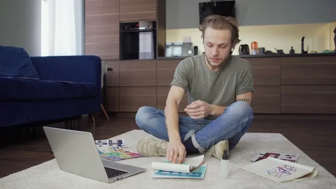 Man spraying sanitizer while having video call Stock Footage 128572900