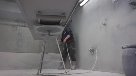 Man spraying vitreous enamel on cladding Stock Footage 255341518