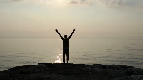 Man with spread arms at the ocean Stock Footage 112165009