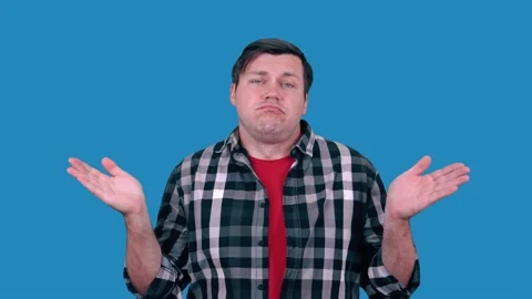A man spread his arms to the sides and pretends to be a fool. Stock Footage 148445379