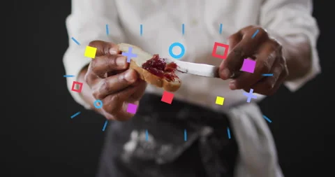 Man spreading fruit jam on bread slice in food marketing demo, showing floating 스톡 동영상 310219282