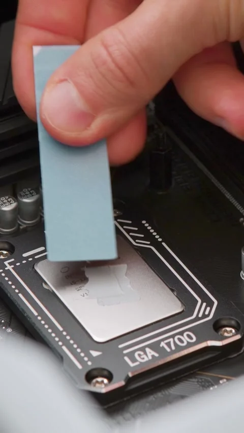 Man spreading thermal paste on a CPU. Computer hardware. Close up Stock Footage 310315625