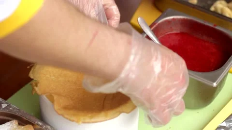 Man spreads Jam on Pancake Stock Footage 48675456