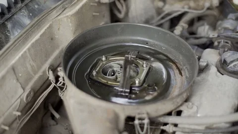 Man sprinkles car engine close-up Stock Footage 72105040