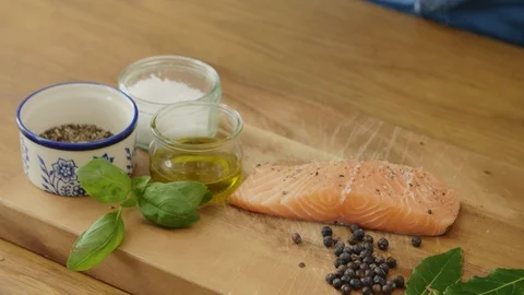 Man Sprinkling Spices Over Raw Fish Fillet By Ingredients Stock Footage 86076217