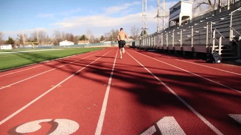 Man Sprinting away from starting position Stock Footage 73405830