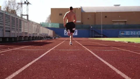 Man Sprinting away on Track Stock Footage 73405870