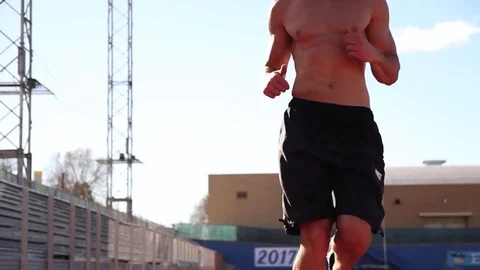 Man sprinting towards camera Stock Footage 73405869