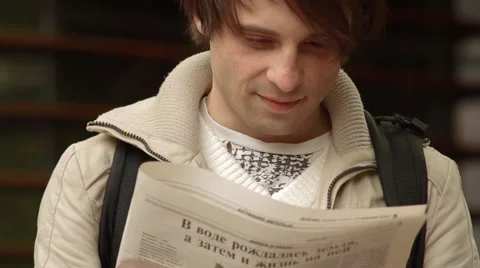 Man Spying and Looking Through the Newspaper Video stock 62994564