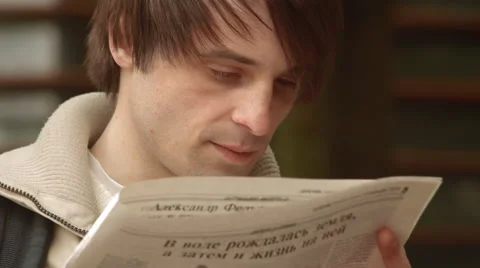 Man Spying and Looking Through the Newspaper Close-Up 스톡 동영상 62994606