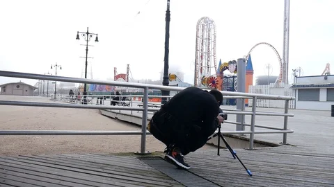 Man Squad Down Photographing Coney Island Boardwalk Foggy Day Stock-Footage 129581210