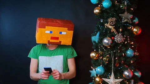 A man in a square hat uses a smartphone. Stock Footage 121250634