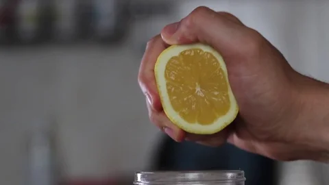 A man squeezes a hand with a lemon Video stock 77589780