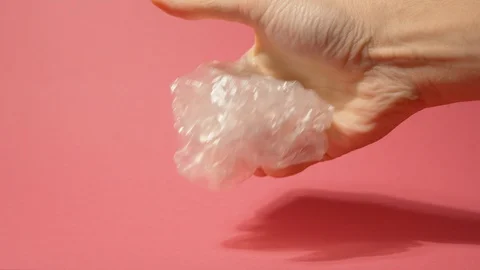 Man Squeezes Plastic Bag in hand 스톡 동영상 124698070