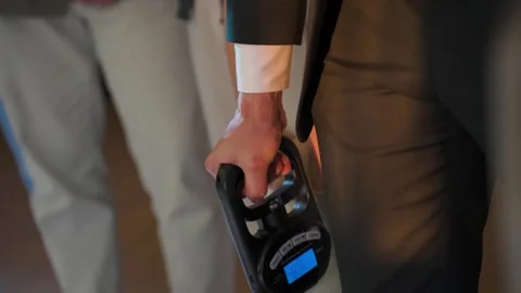 A man squeezes a wrist strength expander Video stock 329092558