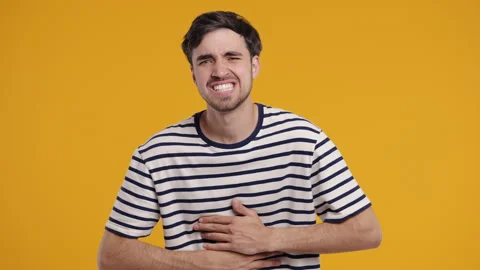 Man Squeezing Belly With Hands, Abdominal Pain. Adult Guy Suffering Stomach Ache Stock-Footage 313793882