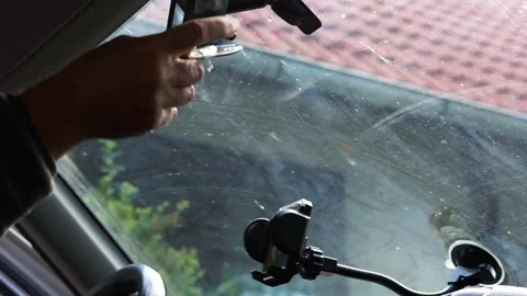 Man squeezing the last drop of the Areon liquid car freshener. Stock Footage 312131011