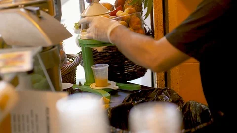 A man squeezing orange juice Video stock 87988635