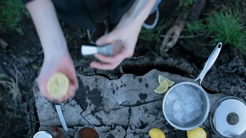 Man squeezing a slice of lemon Video stock 94883755