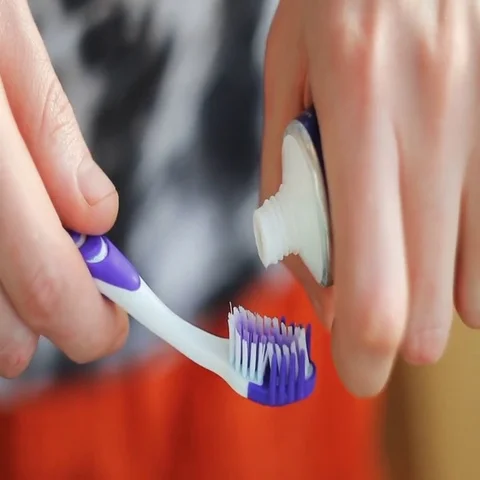 Man squeezing toothpaste on the brush Video stock 69438643