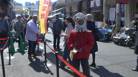 Man With Squid Costume Inside The Biggest Fish Market In Tokyo, Japan Stock Footage 158992635