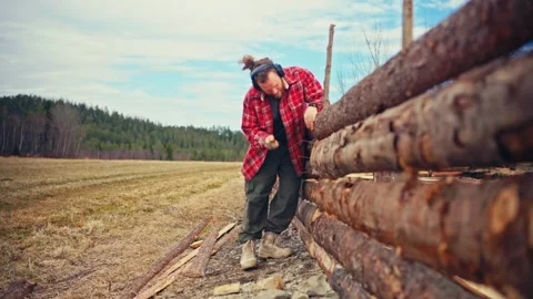 Man Stacking and Fitting Timber Logs - Norway Stock-Footage 344954993