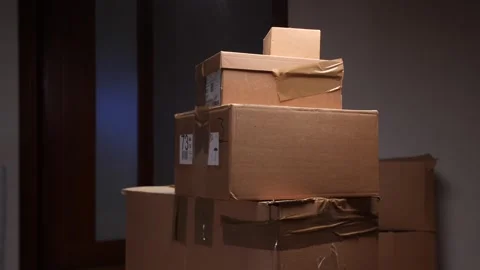 Man stacking cardboard boxes during office relocation Video stock 318980450