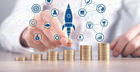 Man stacking coins and rocket. Concept of Growth. Investment. Success Stock Photos