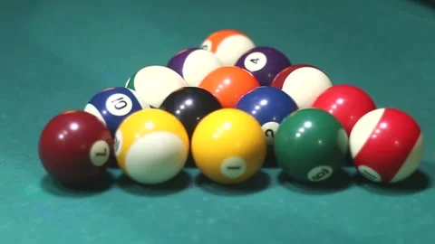 A man stacks billiard balls in a triangle Stock Footage 339029240