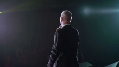 Man at the stage speaking Stock Footage 90245759