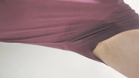 Man with a stain of sweat on it. He sweats from the heat. Problem with Stock Footage 164085123
