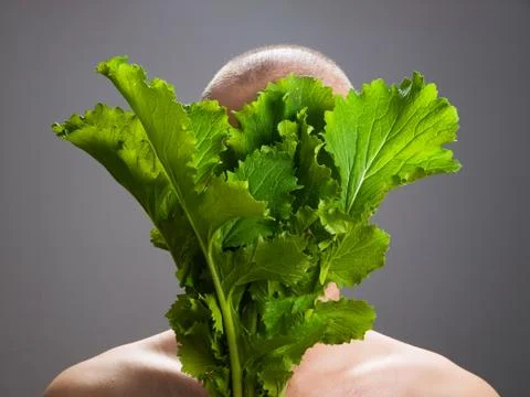Man with a stalk of vegetable Stock Photos