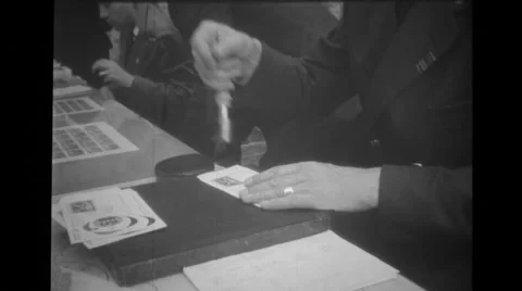 Man stamping envelopes at Brussels World's Fair Stock Footage 37595049