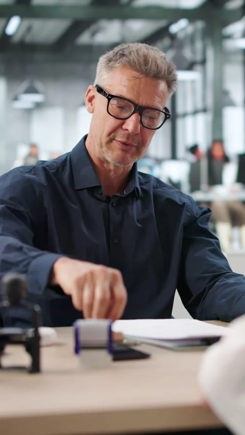 Man Stamping Important Property Document Stock Footage 336792920