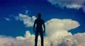 The man stand against the background of cloud flow. Real time capture 4k or 4k+ Resolution