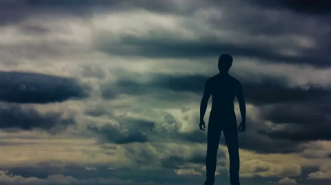 The man stand against the background of rain cloud. Time lapse. Wide angle Stock-Footage 61779223