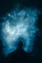 The man stand on the background of a blue smoke Photo