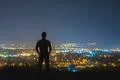 The man stand on the background of the city lights. night time Photo