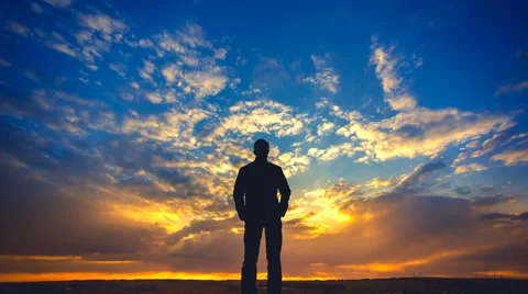 The man stand on the background of cloud flow. Time lapse Stock Footage 62857412