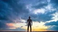 The man stand on the background of cloud flow. Time lapse 4k or 4k+ Resolution