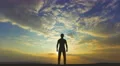 The man stand on the background of cloud flow. Time lapse 4k or 4k+ Resolution