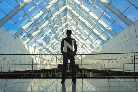 The man stand on the bridge in the business center Stock Photos