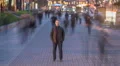 The man stand in crowd flow. Evening night time. Time lapse 4k or 4k+ Resolution