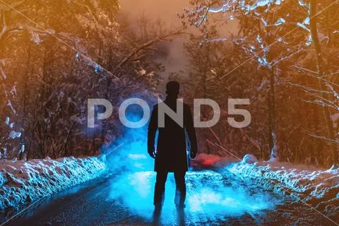 The man stand on a forest road on the smoke background. evening night time Stock Photos