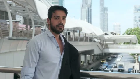 Man stand in front of office building smoking after finishing meeting. Video stock 171011568