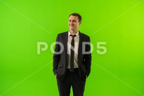 The man stand on the green background Stock Photos